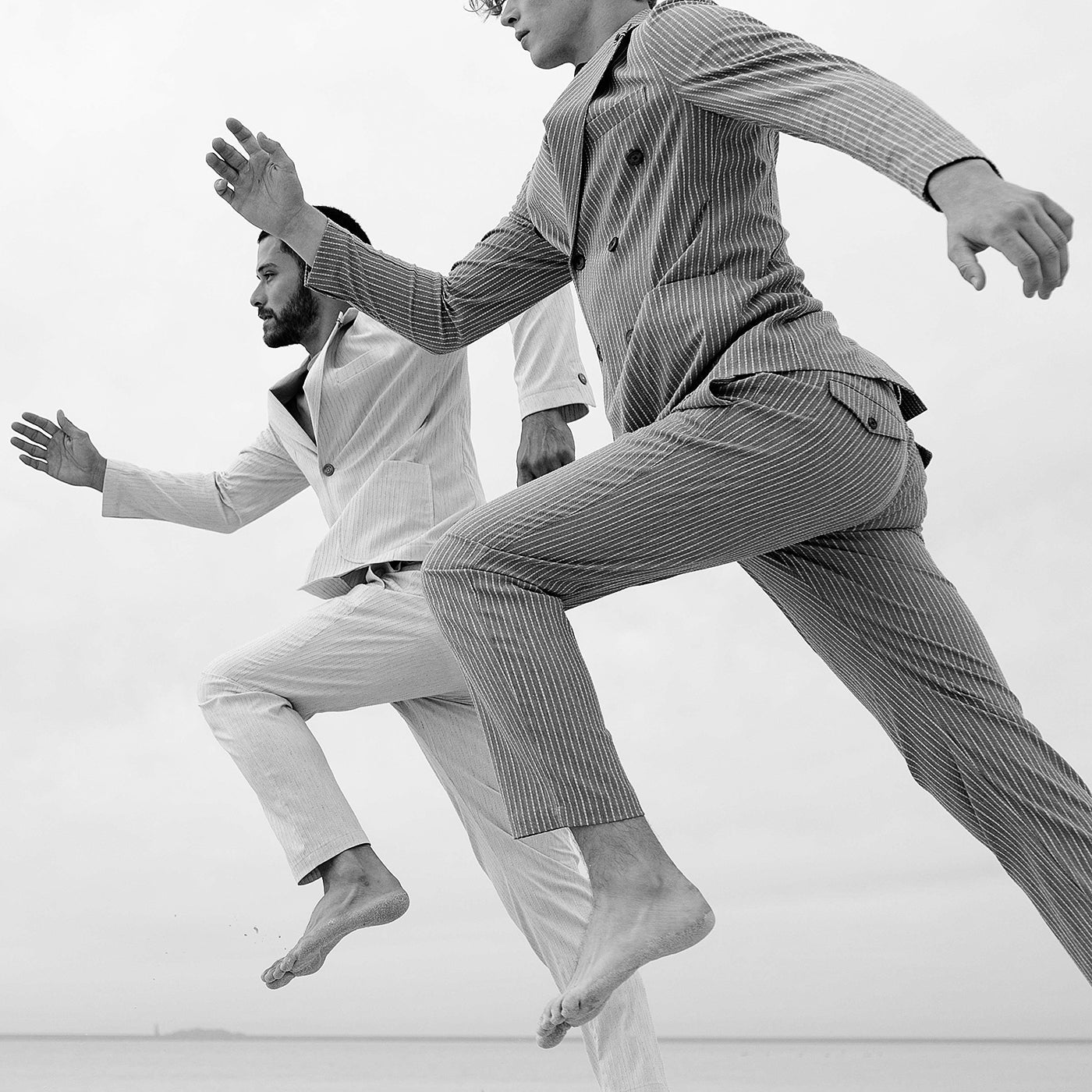 cover image black and white with boys jumping for rewards page distretto12 menswear